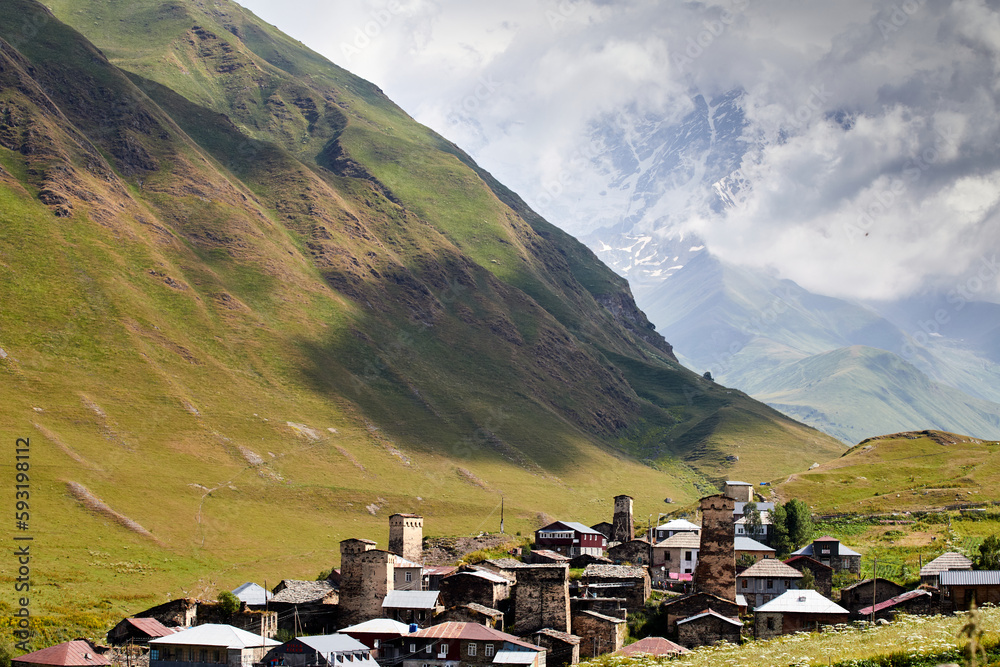 A view of Adishi villgae in Svaneti, Georgia, in Greater Caucasus, 2,040m. with the mountain covered in clouds in the background