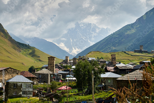 A view of Adishi villgae in Svaneti, Georgia, in Greater Caucasus, 2,040m. with the mountain covered in clouds in the background photo