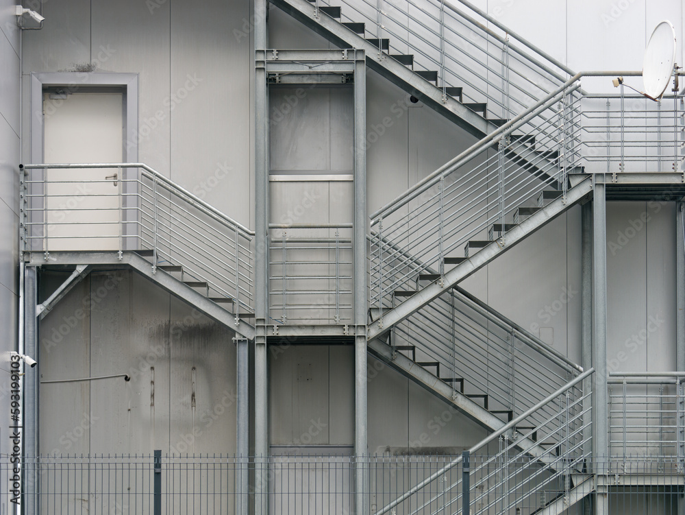 The metal staircase on the exterior of the warehouse The metal staircase on the exterior of the warehouse