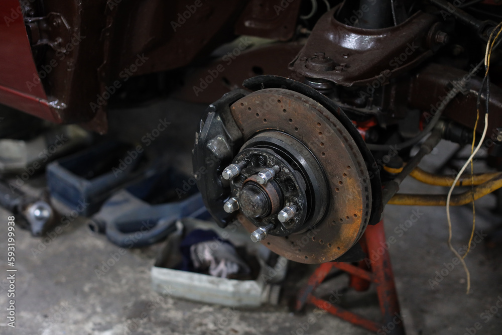 Breakdown vehicle disc break part at repair garage station. Concept of car center repair service.