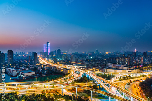 Night view of Saihong Bridge and city skyline in Nanjing, Jiangsu, China