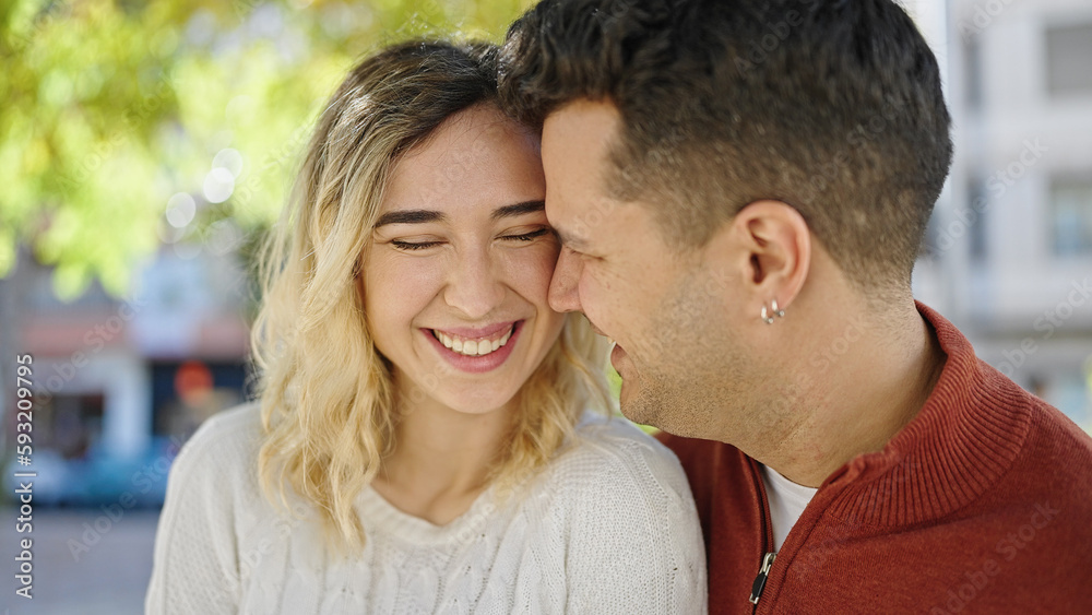 Man and woman couple smiling confident standing together at park Man and woman couple smiling confident standing together at park