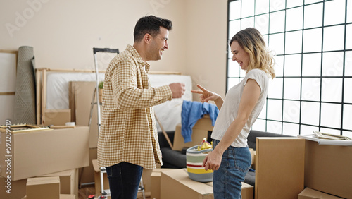 Man and woman couple playing lucky game with hands at new home