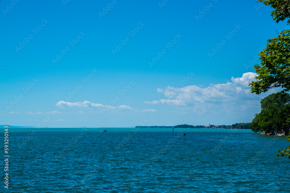 Germany, Beautiful panorama view bodensee blue lake water coast from lindau, sailboats lake sunny day vacation mood