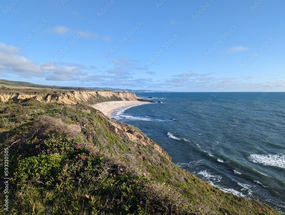 view of the coastal cliffs over the Pacific Ocean in Half Moon Bay, California