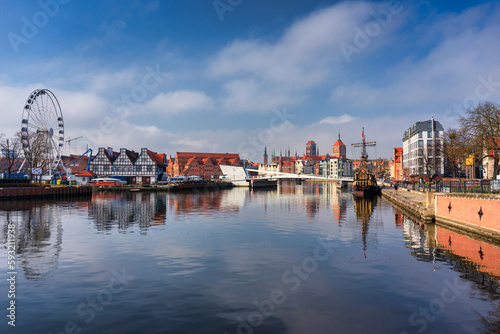 Old town of Gdansk reflected in the Motlawa river at spring, Poland.