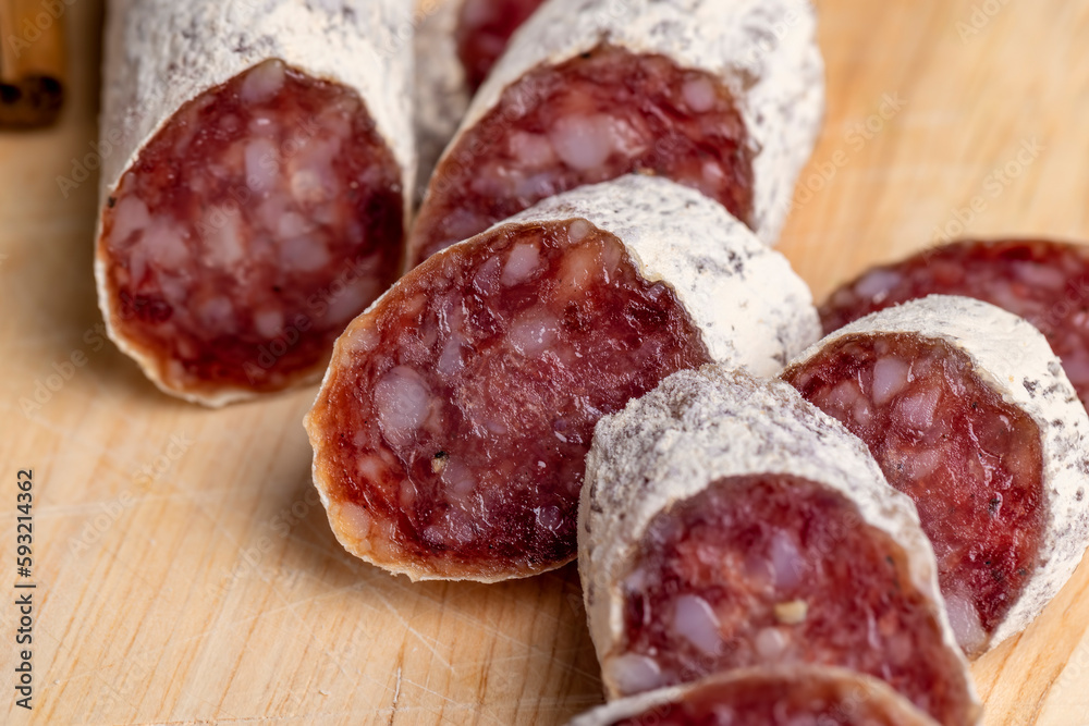 Slices of cylindrical sausage cut into chunks Slices of cylindrical sausage cut into chunks