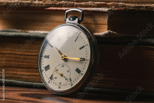 Pocket Watch and Old Book in Vintage Style