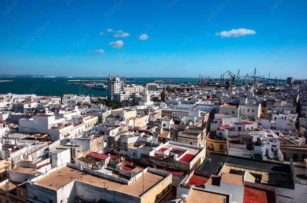 Aerial top view of the roofs of Cadiz and the ocean. Andalusia, Spain