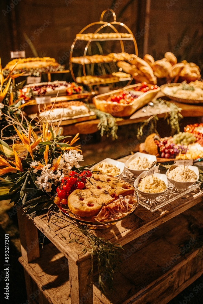 Wooden table with a variety of sweets and dishes