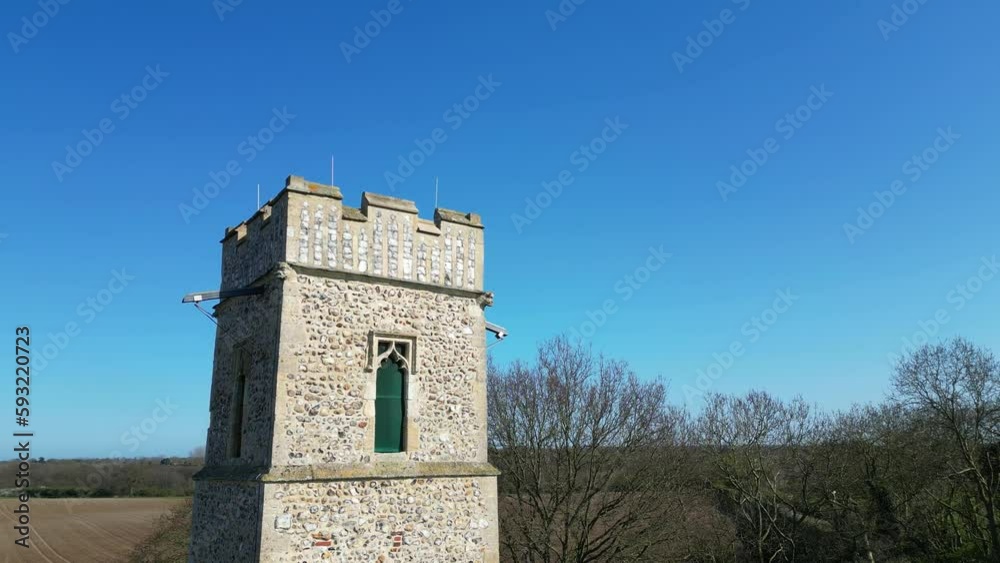 Anti clockwise orbit shot the 14th century tower of All Saints Church in the village of Panxworth in the Norfolk Broads. Captured on a bright and sunny afternoon Anti clockwise orbit shot the 14th century tower of All Saints Church in the village of Panxworth in the Norfolk Broads. Captured on a bright and sunny afternoon