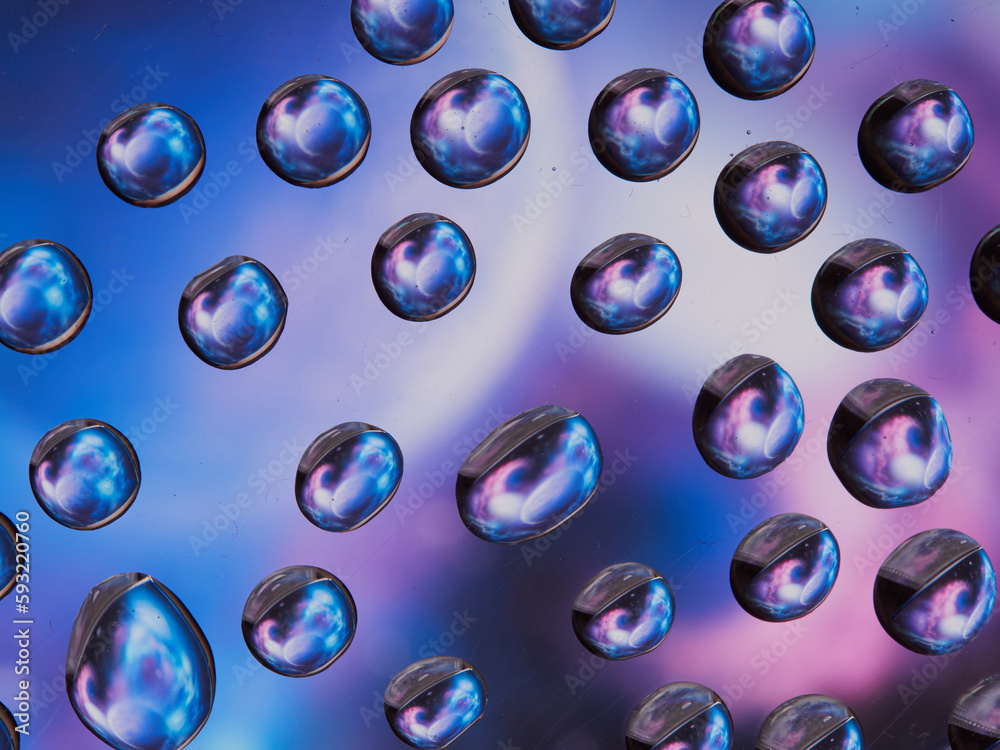 Water drops on the texture of a colored background. the rear window is covered with water droplets. bubbles in the water