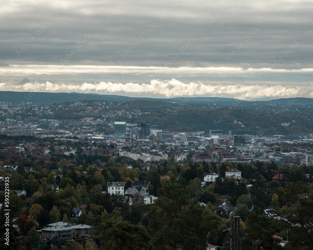 Aerial view of the cityscape with a cloudy sky in the background, Oslo, Norway