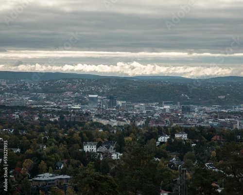 Aerial view of the cityscape with a cloudy sky in the background, Oslo, Norway