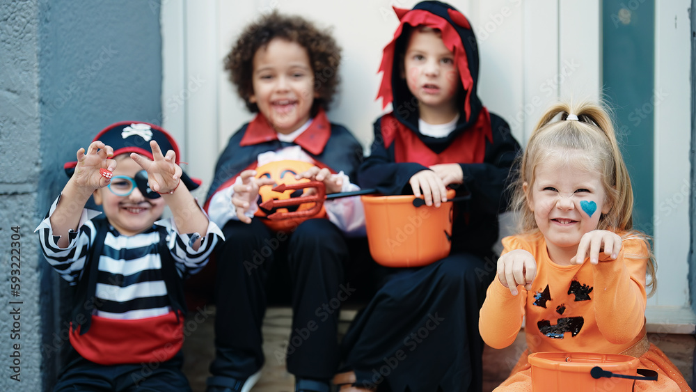 Obraz premium Group of kids wearing halloween costume doing fear gesture at street