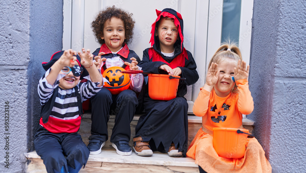 Group of kids wearing halloween costume doing fear gesture at street