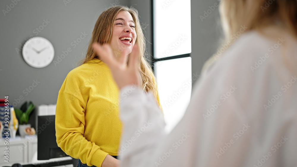 Fototapeta premium Young blonde woman doctor and patient having medical consultation at clinic