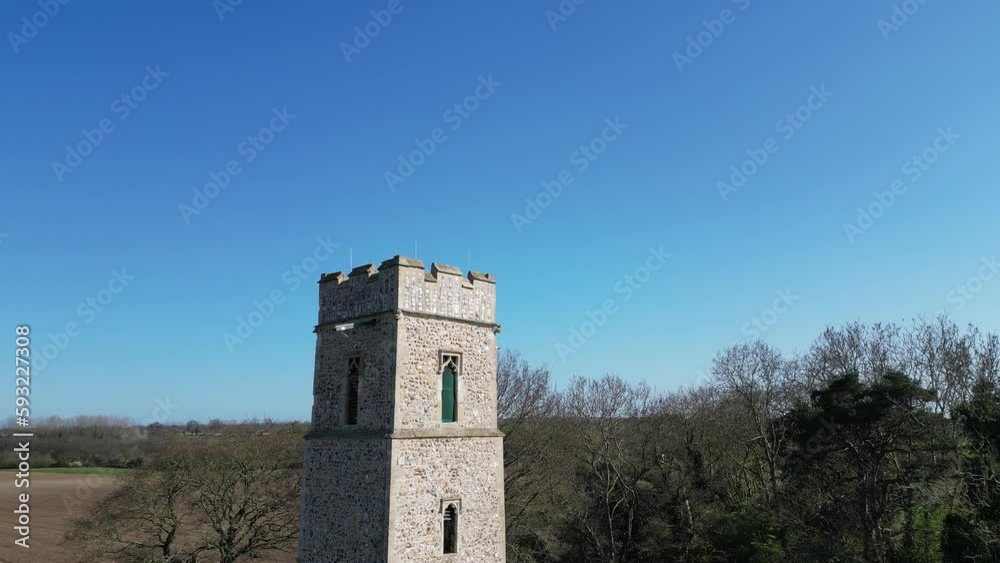 Anti clockwise orbit shot of the 14th century tower of all Saints Church in the village of Panxworth in the Norfolk Broads. Captured on a bright and sunny afternoon Anti clockwise orbit shot of the 14th century tower of all Saints Church in the village of Panxworth in the Norfolk Broads. Captured on a bright and sunny afternoon