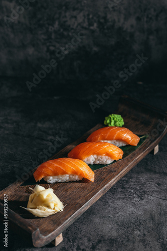 isolated sushi and rolls on a dark contrasting background, menu format