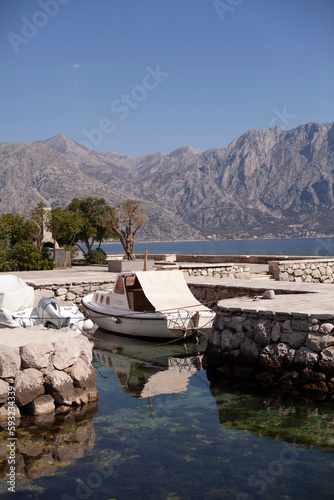 Sea, mountain, boat. Spring landscape. Montenegro, Kotor Bay view.
