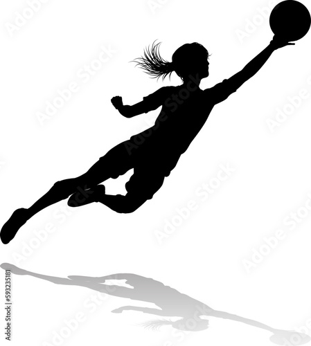 A female soccer football player woman in silhouettes