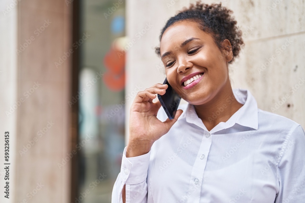 African american woman smiling confident talking on the smartphone at street African american woman smiling confident talking on the smartphone at street