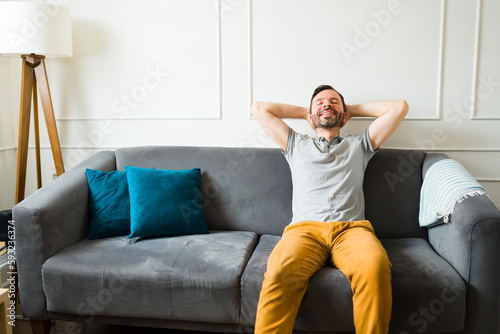 Cheerful man relaxing on the couch