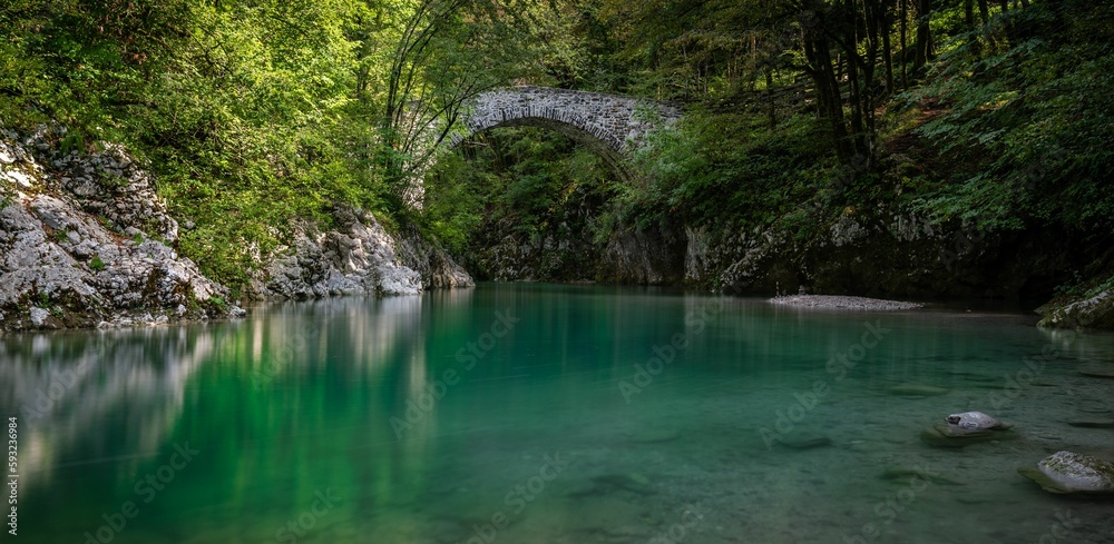 Natural view of the Napoleons Bridge over the Nadiza River in the forest of Slovenia Natural view of the Napoleons Bridge over the Nadiza River in the forest of Slovenia