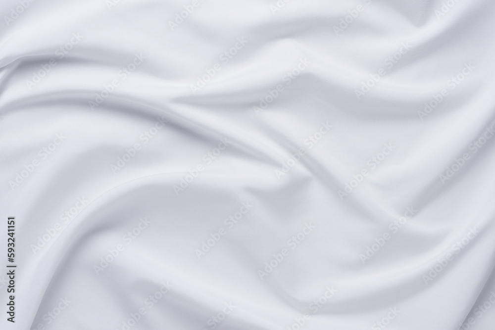 White fabric. luxurious white fabric texture background. Creases of satin, silk and cotton.