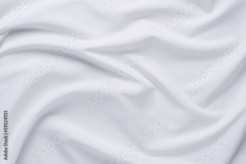 White fabric. luxurious white fabric texture background. Creases of satin, silk and cotton.