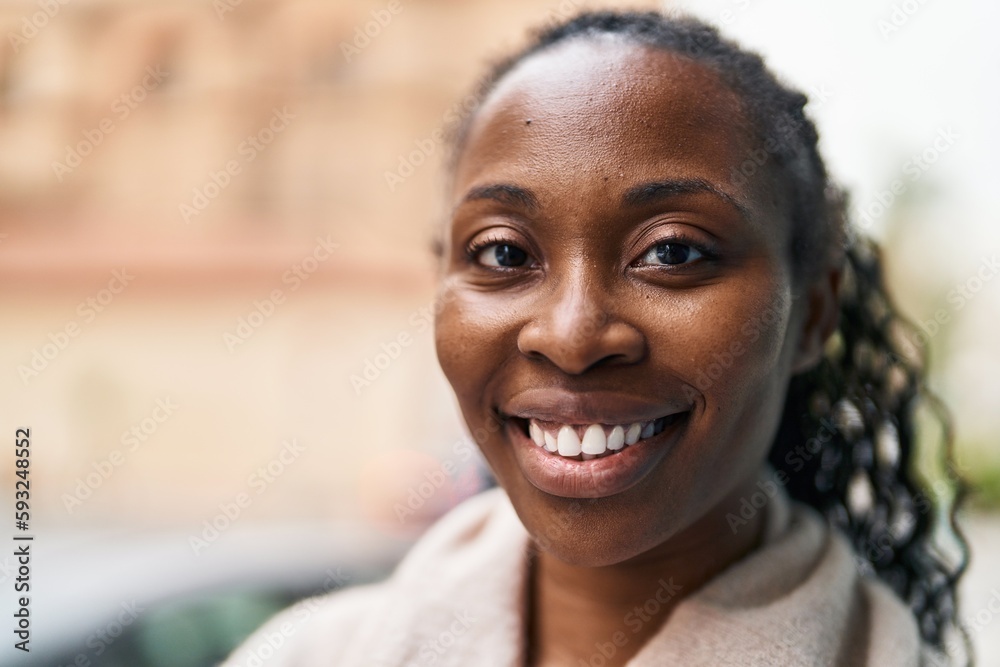 African american woman smiling confident standing at street