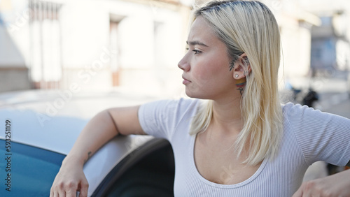 Young beautiful hispanic woman leaning on car door at street Free Download Young beautiful hispanic woman leaning on car door at street - GFXLoad
