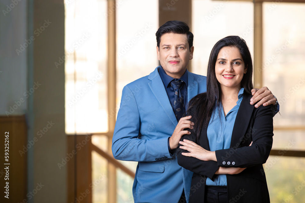 Young indian businessman with female manager at office. Young indian businessman with female manager at office.