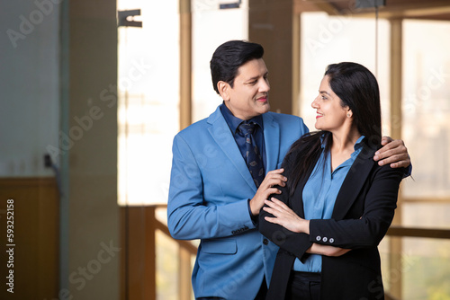 Young indian businessman with female manager at office.