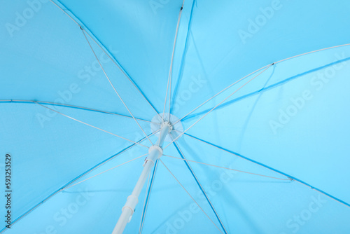 Blue beach umbrella as background
