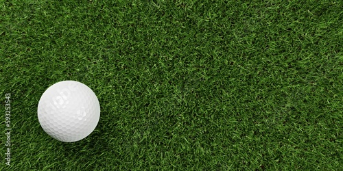 Single white golf ball on green grass background with copy space top view from above