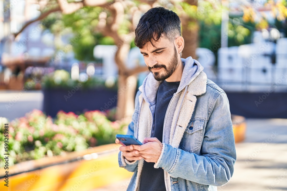Young hispanic man smiling confident using smartphone at park Young hispanic man smiling confident using smartphone at park