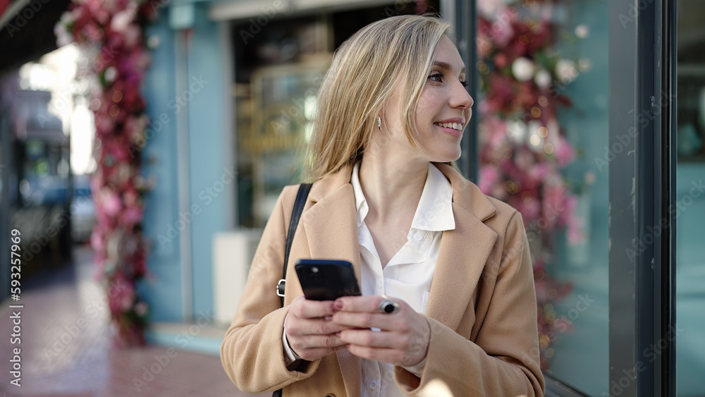 Young blonde woman smiling confident using smartphone at coffee shop terrace Young blonde woman smiling confident using smartphone at coffee shop terrace