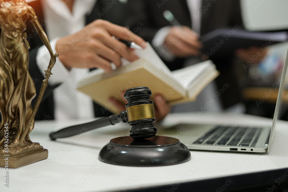judge on wooden table And experienced lawyers meet with clients and give advice behind the scenes. legal services legal consulting concept judge on wooden table And experienced lawyers meet with clients and give advice behind the scenes. legal services legal consulting concept