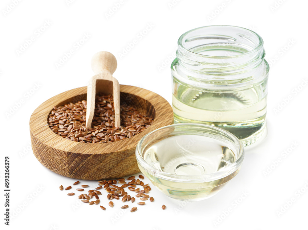 Jar and bowl with flax oil and seeds on white background