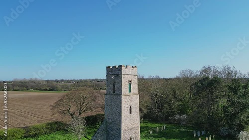 Orbit shot around the 14th century tower of all Saints Church in the village of Panxworth in the Norfolk Broads. Captured on a bright and sunny afternoon photo