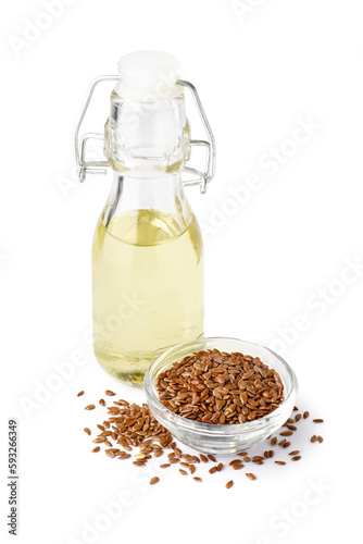 Bottle with flax oil and bowl of seeds on white background