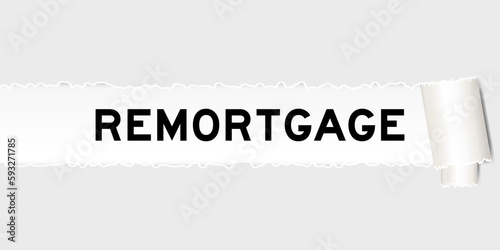 Ripped gray paper background that have word remortgage under torn part