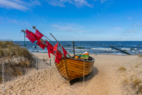 Fototapeta Naklejka Na Ścianę i Meble -  fishing boat on the baltic sea beach