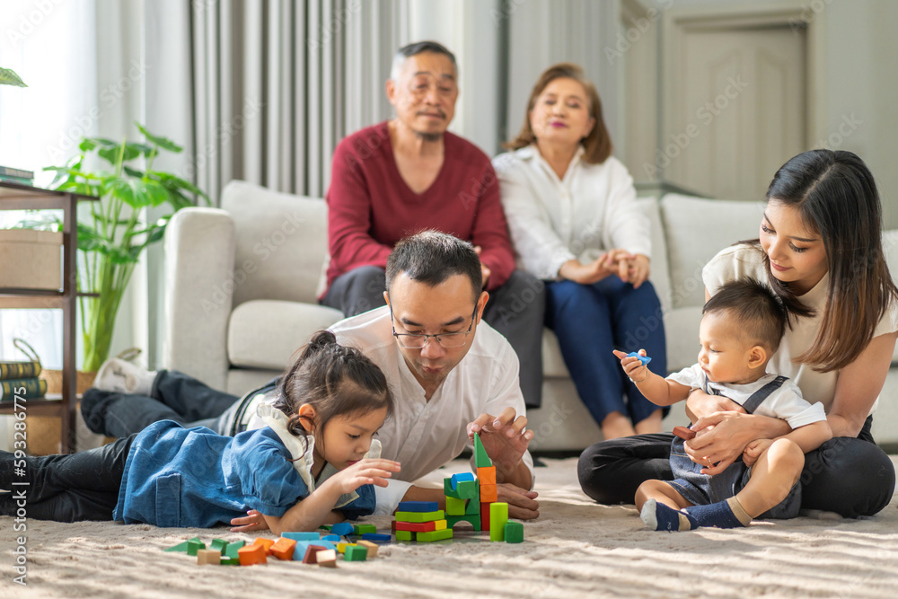 Portrait of enjoy happy love asian big family father and mother with little asian girl smiling activity learn and skill brain training play with toy build wooden blocks board education game at home Portrait of enjoy happy love asian big family father and mother with little asian girl smiling activity learn and skill brain training play with toy build wooden blocks board education game at home