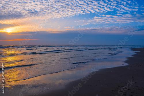 Sunset over the North Sea at the beach of Egmond aan Zee NL