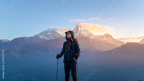 A young traveller trekking in Poon Hill view point in Ghorepani, Nepal.. photo