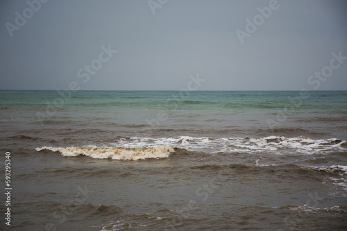 View landscape seascape and wave in sea ocean with island mountain while morning sunrise dawn time for thai people travelers travel visit rest relax at Khlong Wan city in Prachuap Khiri Khan, Thailand