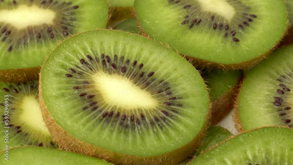 Kiwi fruit slices rotating. 360 degree motion of kiwis. Kiwi fruit slices rotating. 360 degree motion of kiwis.
