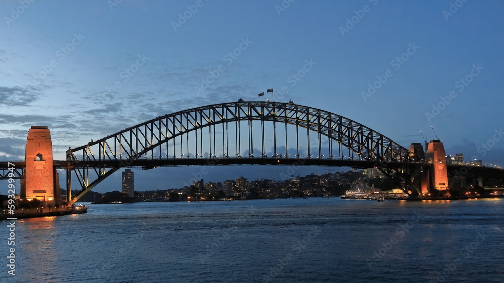 Sydney Harbour Bridge-arch and pylons-viewed from the Opera House at twilight under floodlight. NSW-Australia-585